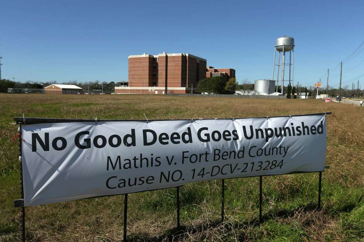 Harold Mathis posted this banner on his property, which lies next to the Fort Bend County Jail. The banner was a reference to the frustration he felt from what he saw as helping the county, only to have his land ruined by their development.﻿