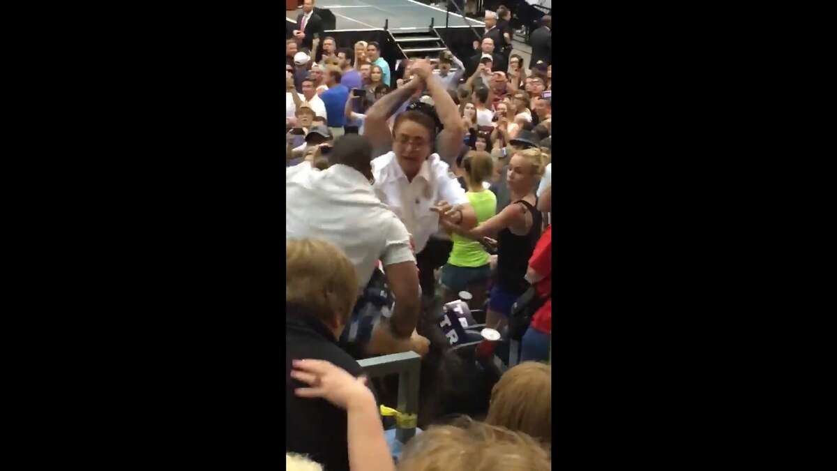 Tony Pettway, 32, has been charged with allegedly assaulting protester Bryan Sanders at a Trump rally Saturday in the Tucson Convention Center. Video captured by Twitter user Alex Satterly shows Pettway tearing up a sign that Sanders was carrying, sucker-punching Sanders and kicking the protester before he's escorted away by police.