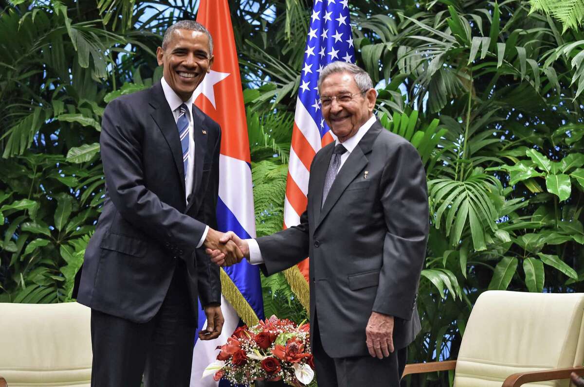 US President Barack Obama (L) and Cuban President Raul Castro shake hands during a meeting at the Revolution Palace in Havana on March 21, 2016. Cuba's Communist President Raul Castro on Monday stood next to Barack Obama and hailed his opposition to a long-standing economic "blockade," but said it would need to end before ties are fully normalized. AFP PHOTO/Nicholas KAMMNICHOLAS KAMM/AFP/Getty Images
