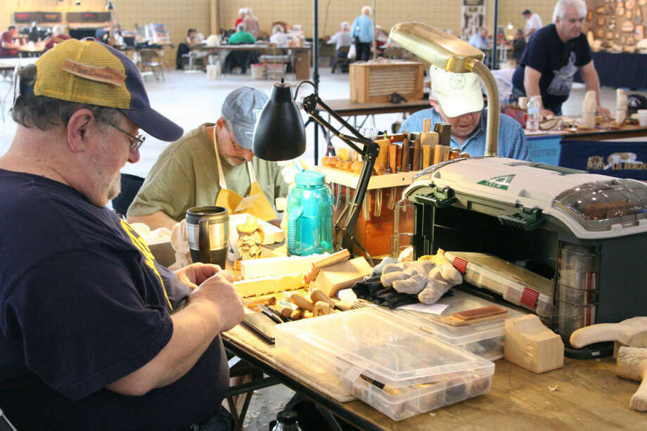 Wood carvers creating at Midland County Fairgrounds 