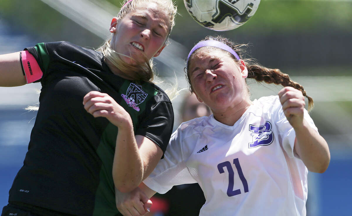 Wildcat forward Abigail Key (left) battles against Emily Blaettner as Boerne loses to Kennedale 4-3 in the Class 4A state girls soccer semifinals at Birkelbach Field in Georgetown on April 15, 2015.