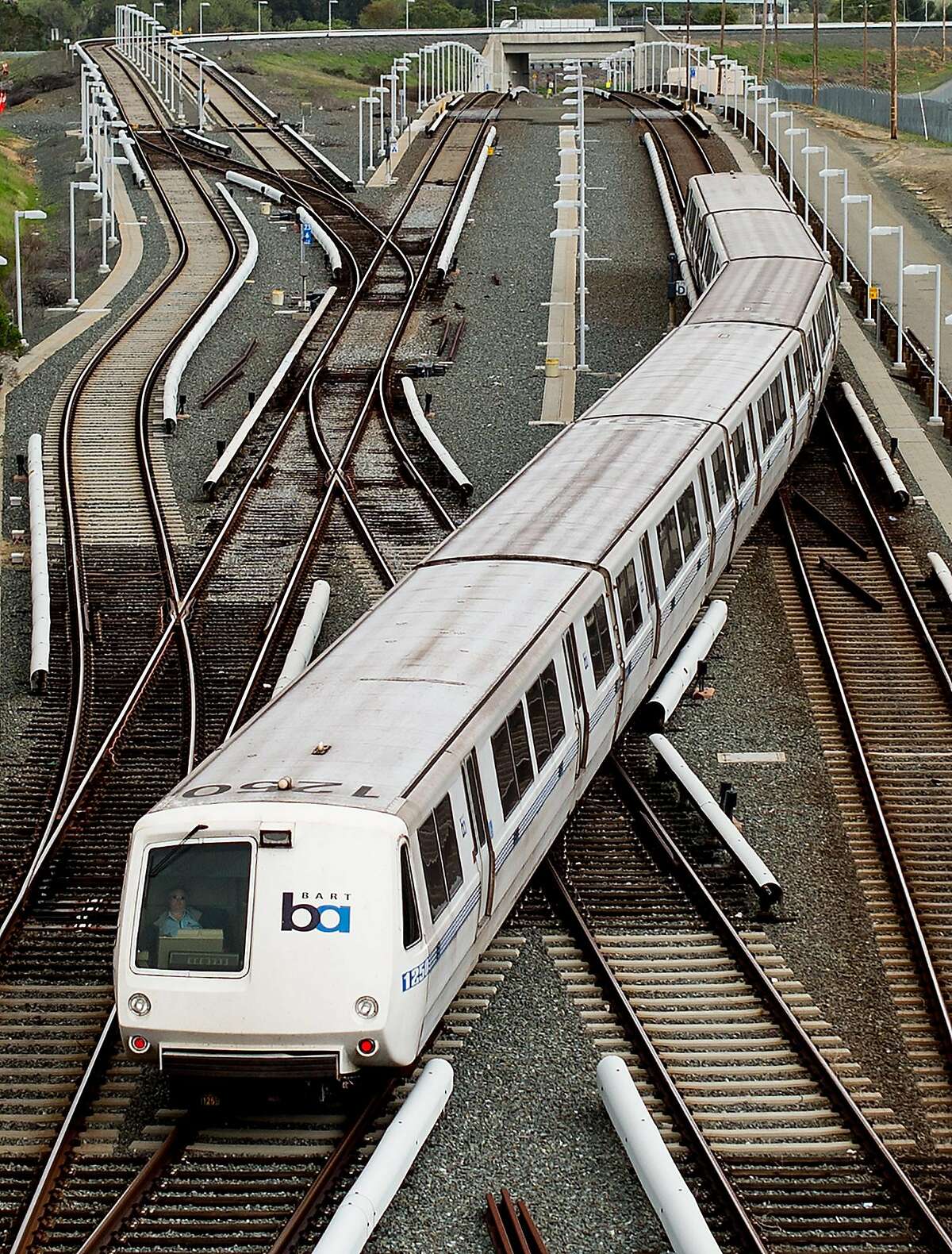 A BART rides over rails just north of the North Concord station on Monday, March 21, 2016, in Concord, Calif. Transit officials said they haven’t pinpointed a “root cause” for a track power-surge problem that halted service between the Pittsburg-Bay Point and North Concord stations.
