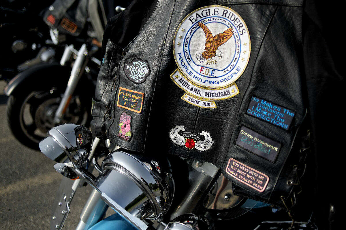 An Eagle Riders leather jacket rests on a Harley Davidson motorcycle arrive before the start of the 9th Annual LUV RIDE for Kids with Cancer Saturday at the Midland Eagles. The ride started at 11 a.m. The motorcyclists participating stopped at the Harrison, West Branch and Albright Shores Eagles before returning to Midland for a dinner, silent auction, raffle, door prizes and live music. All proceeds go to Midland Cancer Services.