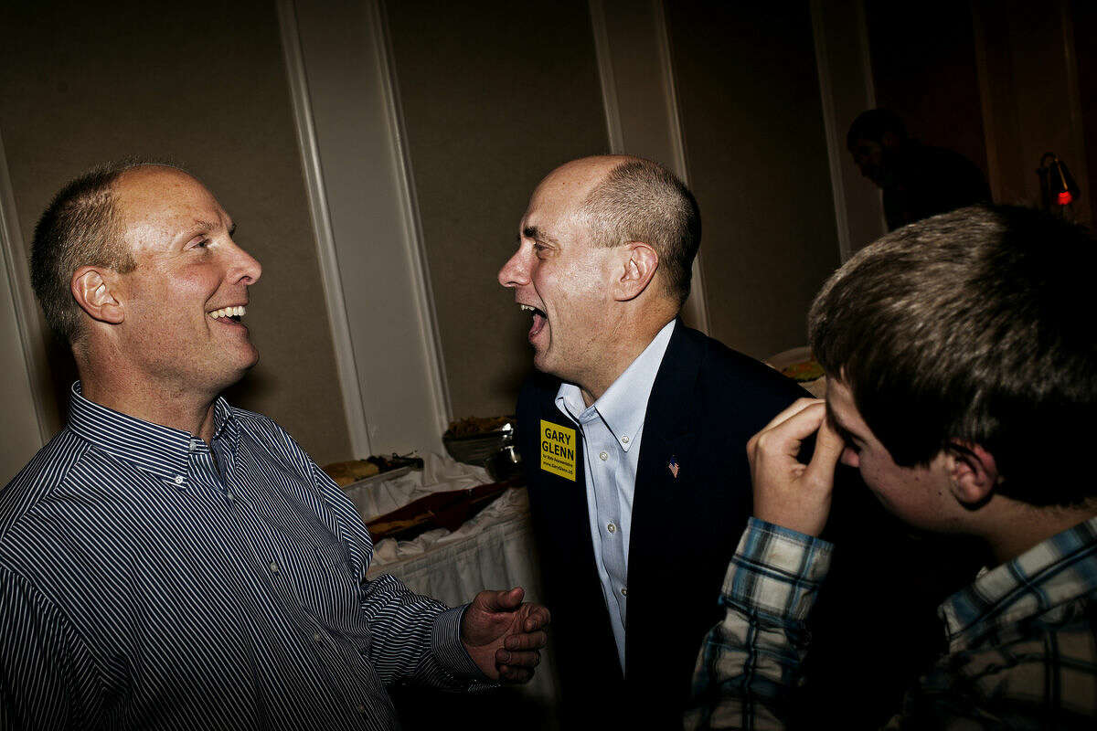 Gary Glenn, Republican candidate for the 98th District of the Michigan House of Representatives, laughs with State Senator John Moolenaar Tuesday during the Republican election party at the H Hotel in downtown Midland. Moolenaar won the race for the Michigan's 4th Congressional distract and Glenn defeated democrat Joan Brausch in the State House race.