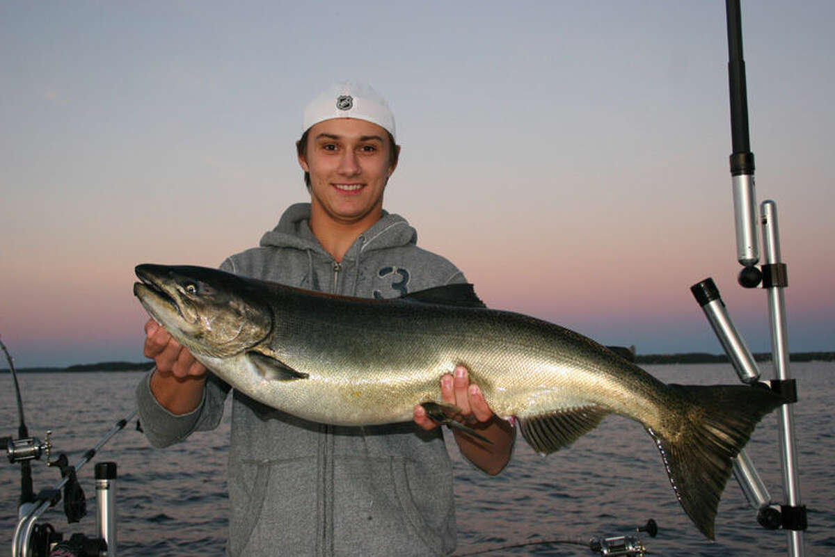 Detroit Red Wings’ goalie prospect Petr Mrazek shows off a king salmon he caught during down time during the Wings’ training camp in Traverse City recently.