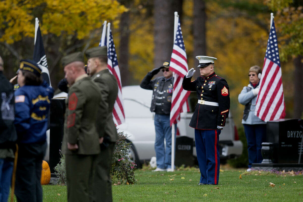 A Marine salutes at the Midland Municipal Cemetery at the burial ceremony of Lance Cpl. Steven Szymanski on Wednesday. Szymanski, of Midland, died on Tuesday, Oct. 21, at Fort Bragg, N.C., in a vehicular accident.