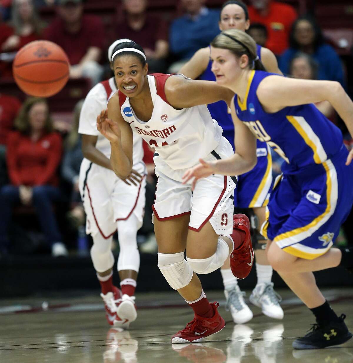 Stanford's Erica McCall and South Dakota State's Macy Miller chase loose ball in 2nd quarter during 2016 NCAA Division 1 Women's Basketball Tournament game in Stanford, Calif., on Monday, March 21, 2016.