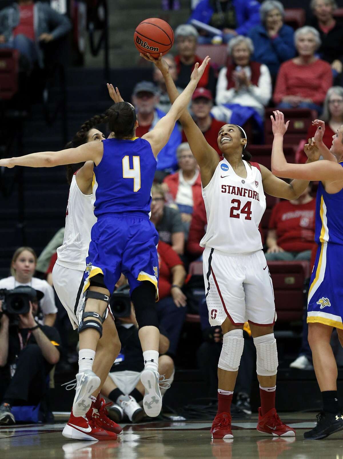 Stanford's Erica McCall and South Dakota State's Gabby Boever vie for a rebound in 1st quarter during 2016 NCAA Division 1 Women's Basketball Tournament game in Stanford, Calif., on Monday, March 21, 2016.