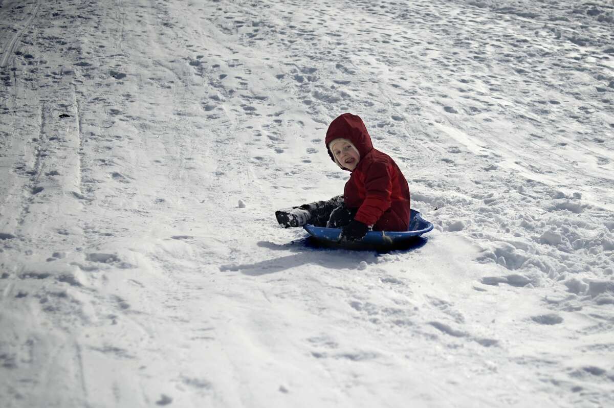 Five-year-old Kai Truitt sleds down the hill at Revere Park on Thursday afternoon. Winter Storm Petros, which started around 11 a.m. on Wednesday, closed schools for a second day in Midland County and in surrounding areas.