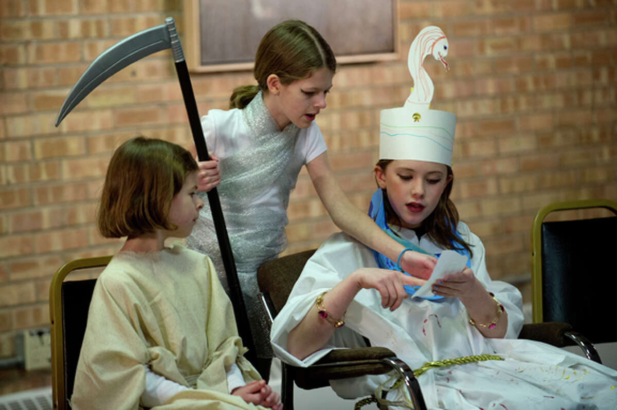 From left, Lydia Webb, 10, her sister Madeline, 11, and Hannah Woehrle, 10, act out a scene during the Flying Pig Theatre Academy's production of "The Gift of the Nile" Wednesday at Creative 360. The class is for students 7-12 and the production was written by student Madeline Webb, 11, and costumes and sets were designed by the students.
