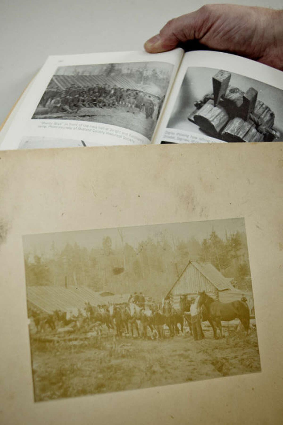 This photograph was donated to the Midland County Historical Society by the family of the late Francis Vinson of Midland. One of the historical society's volunteers matched the 130-year-old photograph with another one taken at the same time and published in a Midland County history book. They are photos of the Wright and Ketchum logging camp in the Averill/Sanford area.
