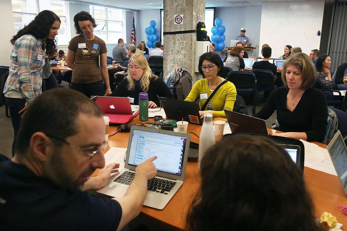 Marc Baizman (front left) salesforce.org staff attends the Nonprofit Starter Pack Community Sprint at United Way in San Francisco, California, on monday, march 21, 2016. Salesforce gets together with nonprofits to brainstorm ideas on how improvements can be made to better meet their needs.