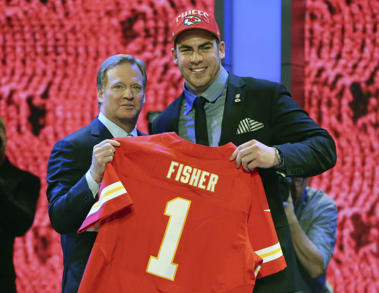 Central Michigan's Eric Fisher holds Super Bowl trophy, and maybe