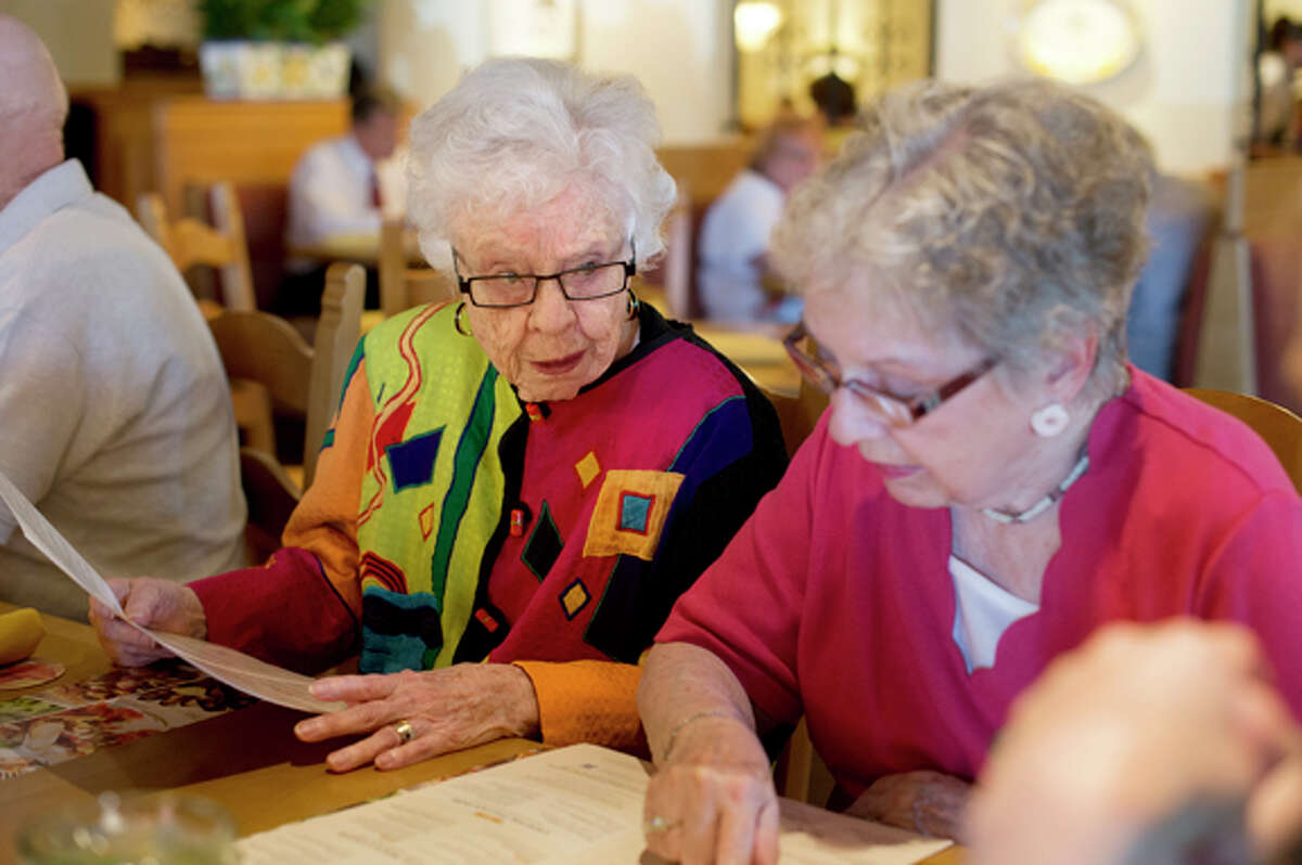 NEIL BLAKE | nblake@mdn.netEleanor Kramer, left, and Barbara Stoughton look over the menu at the Olive Garden in Midland. The women are part the Out to Lunch Bunch and meet up at a local restaurant each month. All the club members live at Riverside Place.