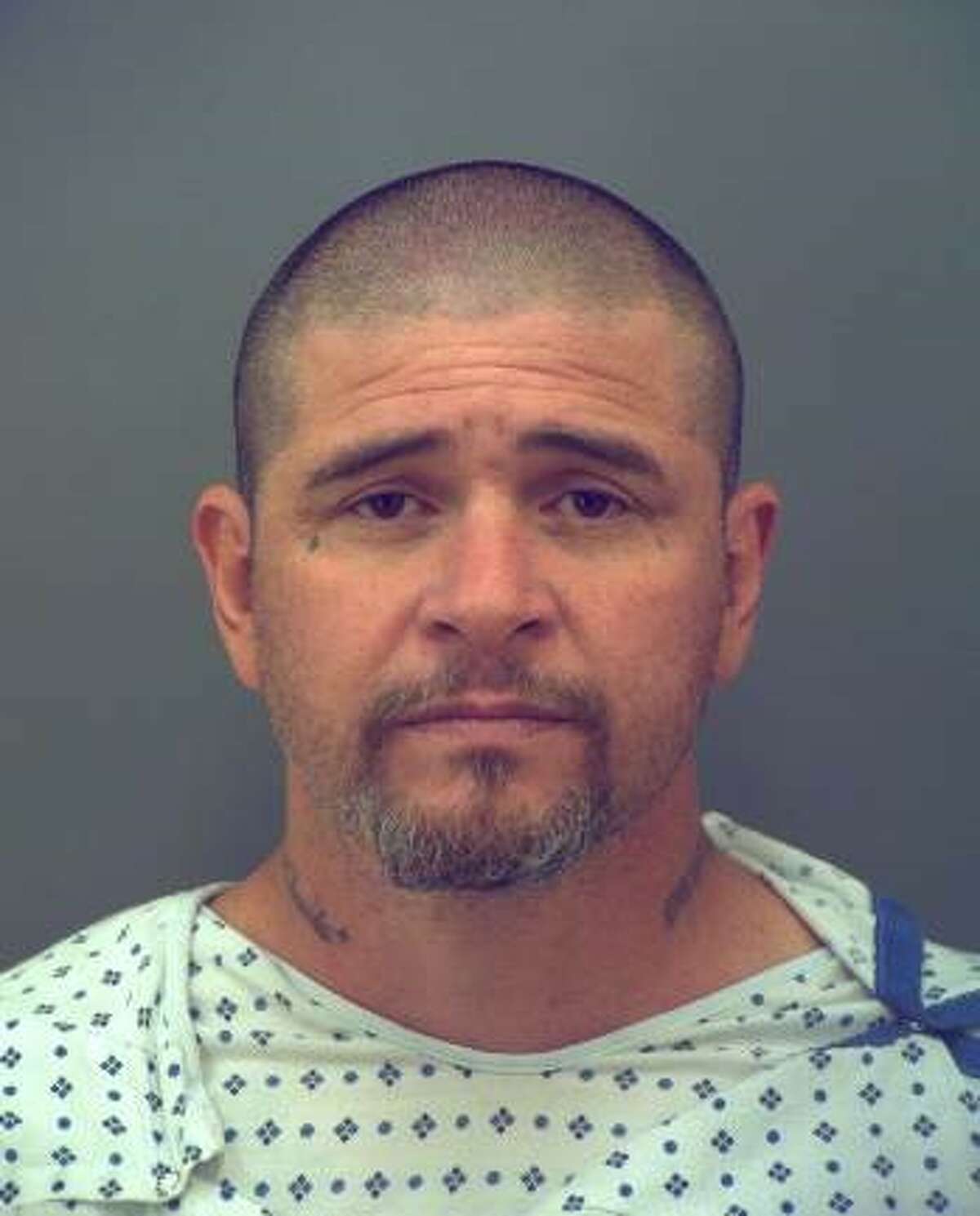 John Perry (pictured) — a 45-year-old El Paso man previously accused of being a member of the Barrio Azteca gang — was behind the wheel of a Kia Optima when he hit a motorcycle driven by Officer David Ortiz from behind on March 10, the El Paso Police Department announced Monday. Ortiz died of his injuries on March 14.