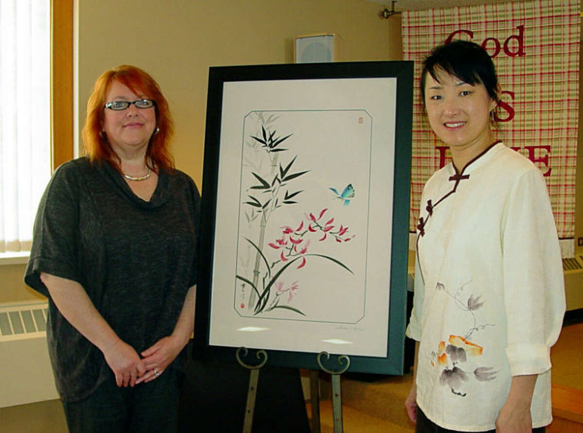 Photo providedMary Gilbert, left, purchased the Chinese Brush Painting created by Louise Chen.