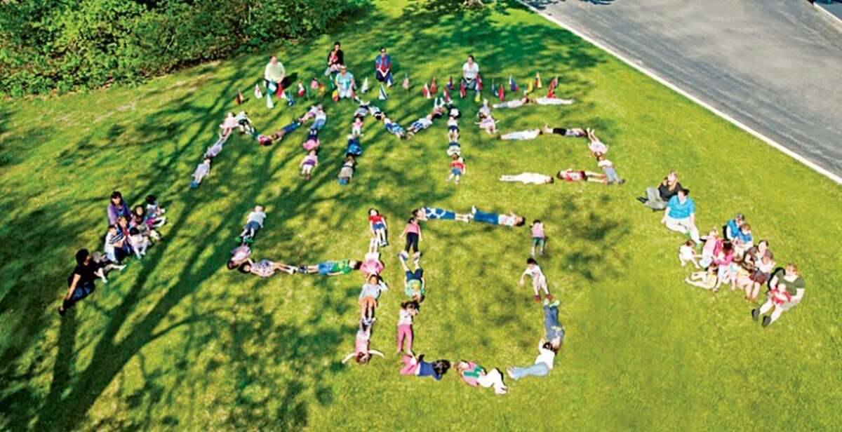 Photo providedChildren lie on the ground spelling out MMS 40 in recognition of the Midland Montessori School’s 40th anniversary this year.