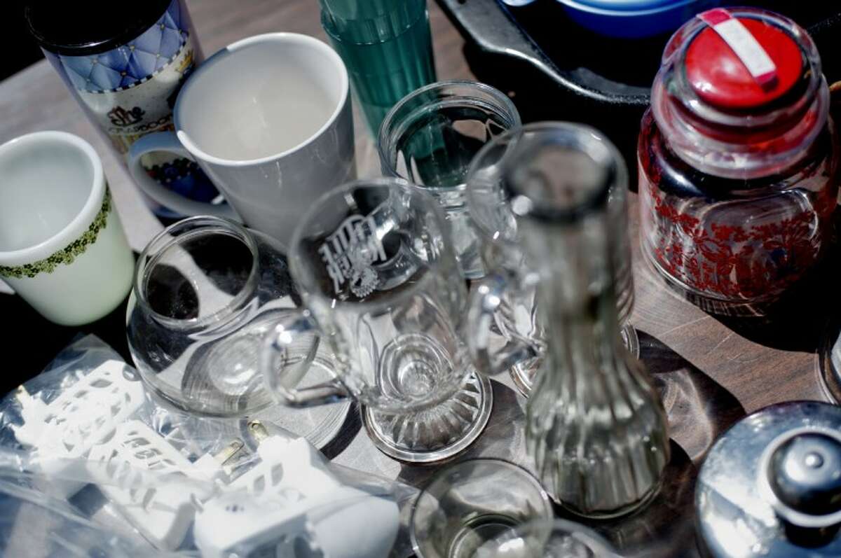FILE — Glassware sits on display for sale at a garage sale in Midland in 2012.