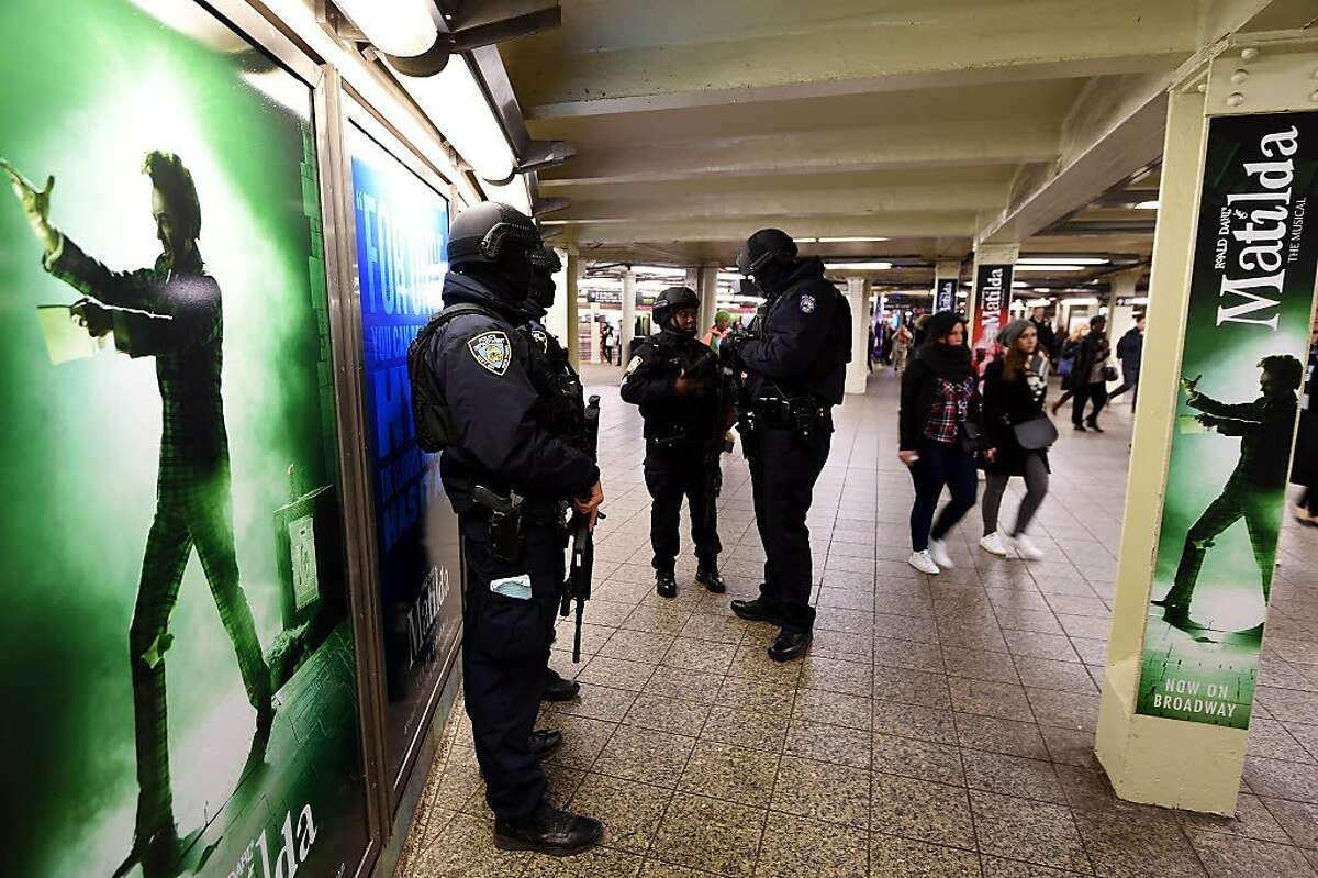 New York Police Department (NYPD) officers stand guard in a subway station on March 22, 2016, in New York. New York and Washington stepped up security in the wake of the attacks in Brussels on March 22, deploying counter-terrorism reinforcements and the National Guard to airports and stations, officials said. The New York Police Department (NYPD) said there was no indication that the attacks in Belgium were connected to New York, but ordered the steps as America's biggest city of 8.4 million began the morning commute. Around 35 people were killed and more than 200 wounded on Tuesday in bombings at the Brussels airport and a metro station in the city that is home to the European Union and NATO. / AFP PHOTO / Jewel SAMADJEWEL SAMAD/AFP/Getty Images