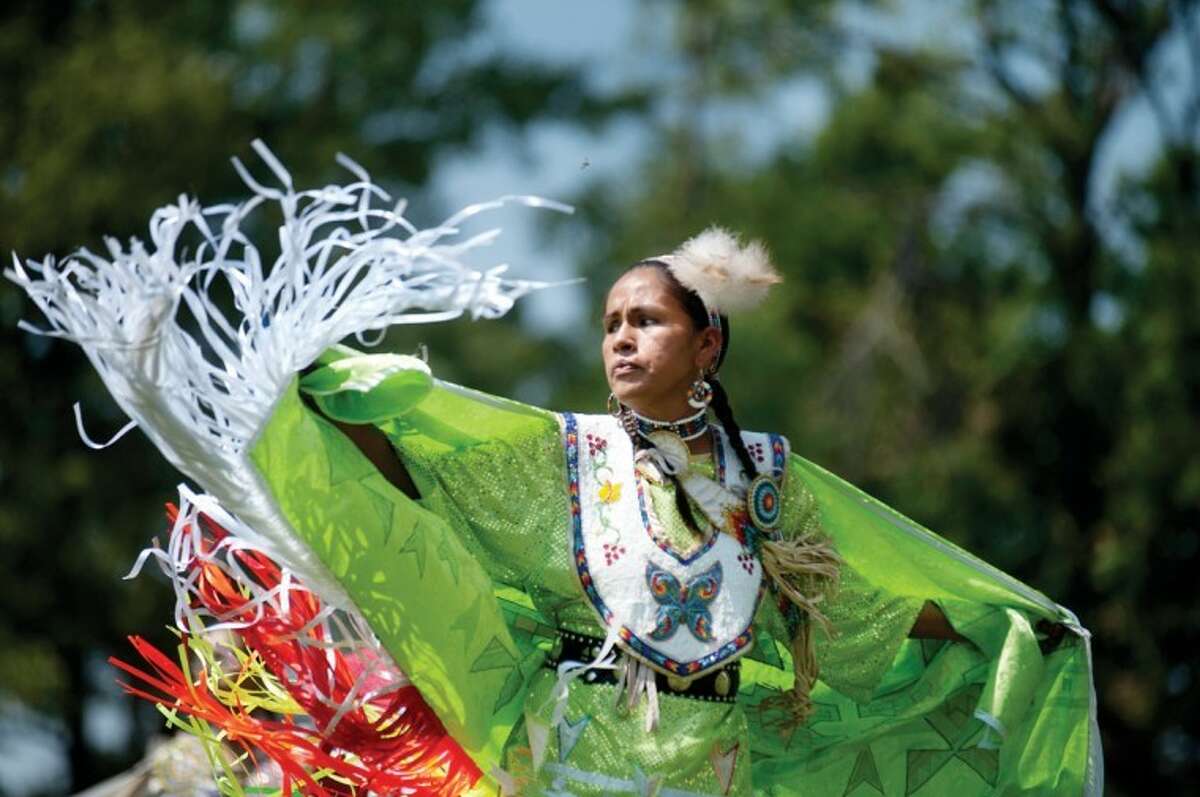 BRITTNEY LOHMILLER | blohmiller@mdn.netPatricia Bugg of Bemidji, Minn., dances in the inter-tribal dance at the 28th Saginaw Chippewa Tribal National Pow Wow Saturday afternoon in Mount Pleasant. Bugg performs with a decorated shawl that represents the opening of a butterfly’s cocoon.