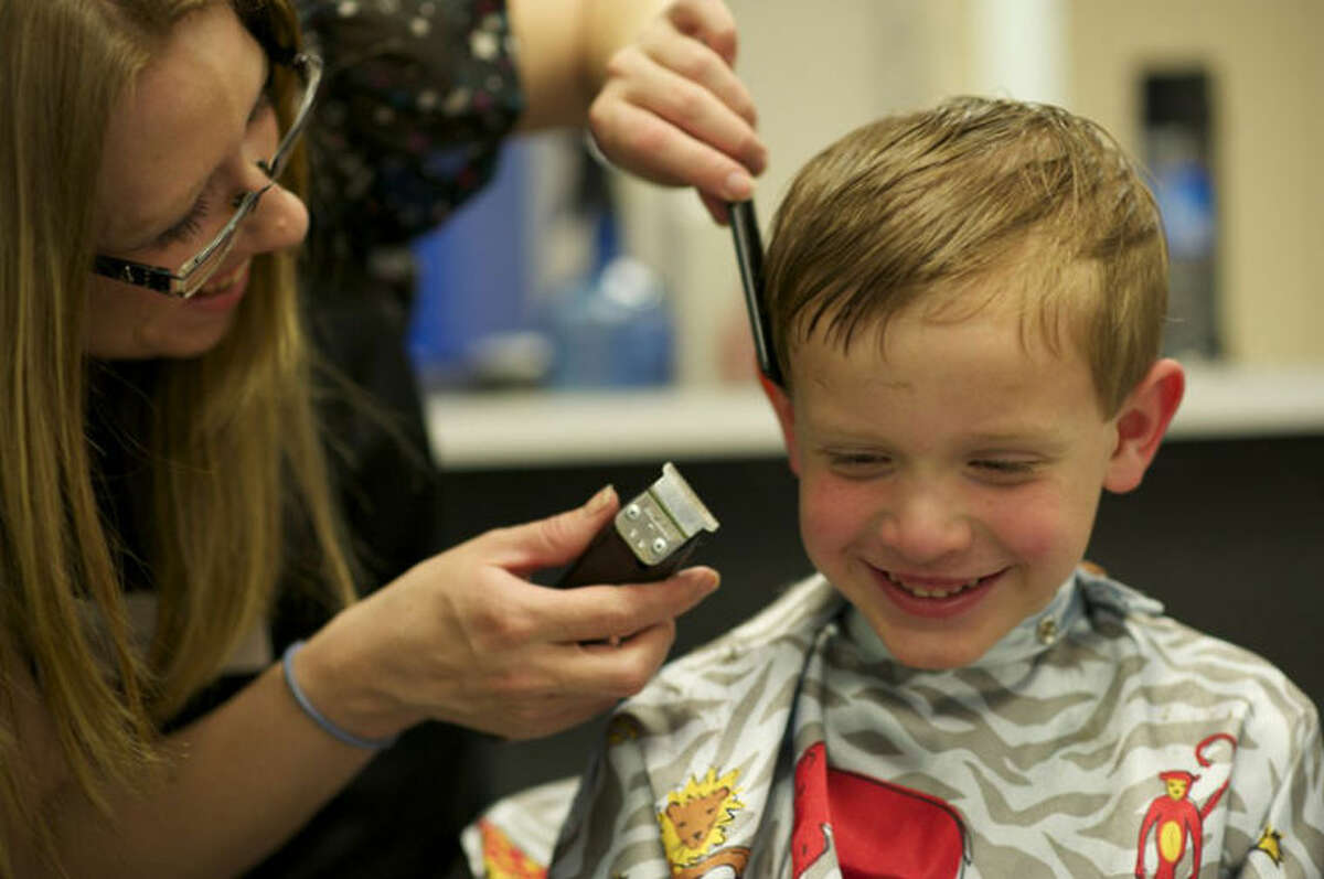 Photo providedA youngster receives a free haircut at West Midland Family Center.