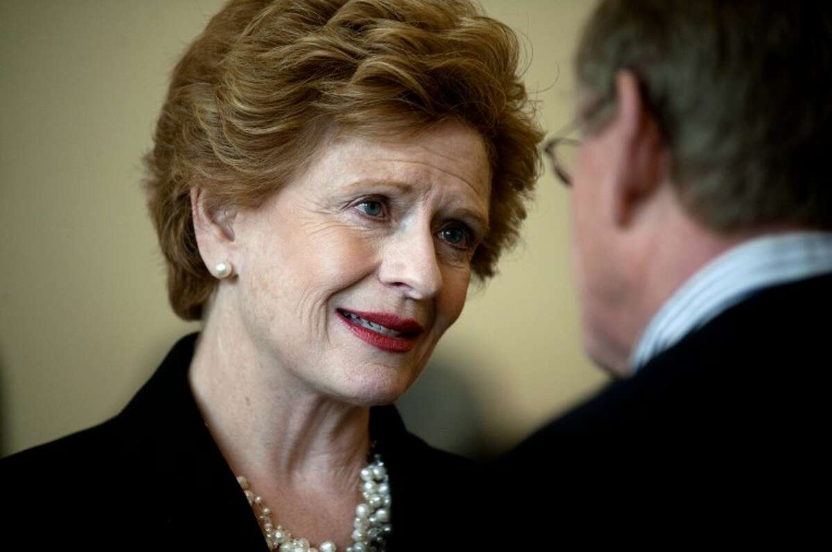 NEIL BLAKE | nblake@mdn.net U.S. Sen. Debbie Stabenow talks with Steve LaLonde at the Midland Area Chamber of Commerce Issues and Answers breakfast on Tuesday. Stabenow spoke about Michigan jobs focusing on advanced battery manufacturing and agriculture.