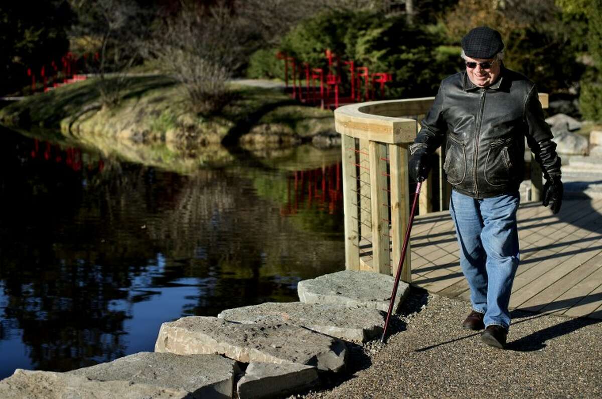 NICK KING | nking@mdn.net Art Frock takes a walk along the new pathway at Dow Gardens on Tuesday. Frock, who was out for an afternoon walk with his wife Judy, said he and his wife have been members for years and the new walkway is "perfect." The new stream-side pathway allows for better accessibility for those who use a wheelchair or for those using strollers and creates a full loop around the gardens.