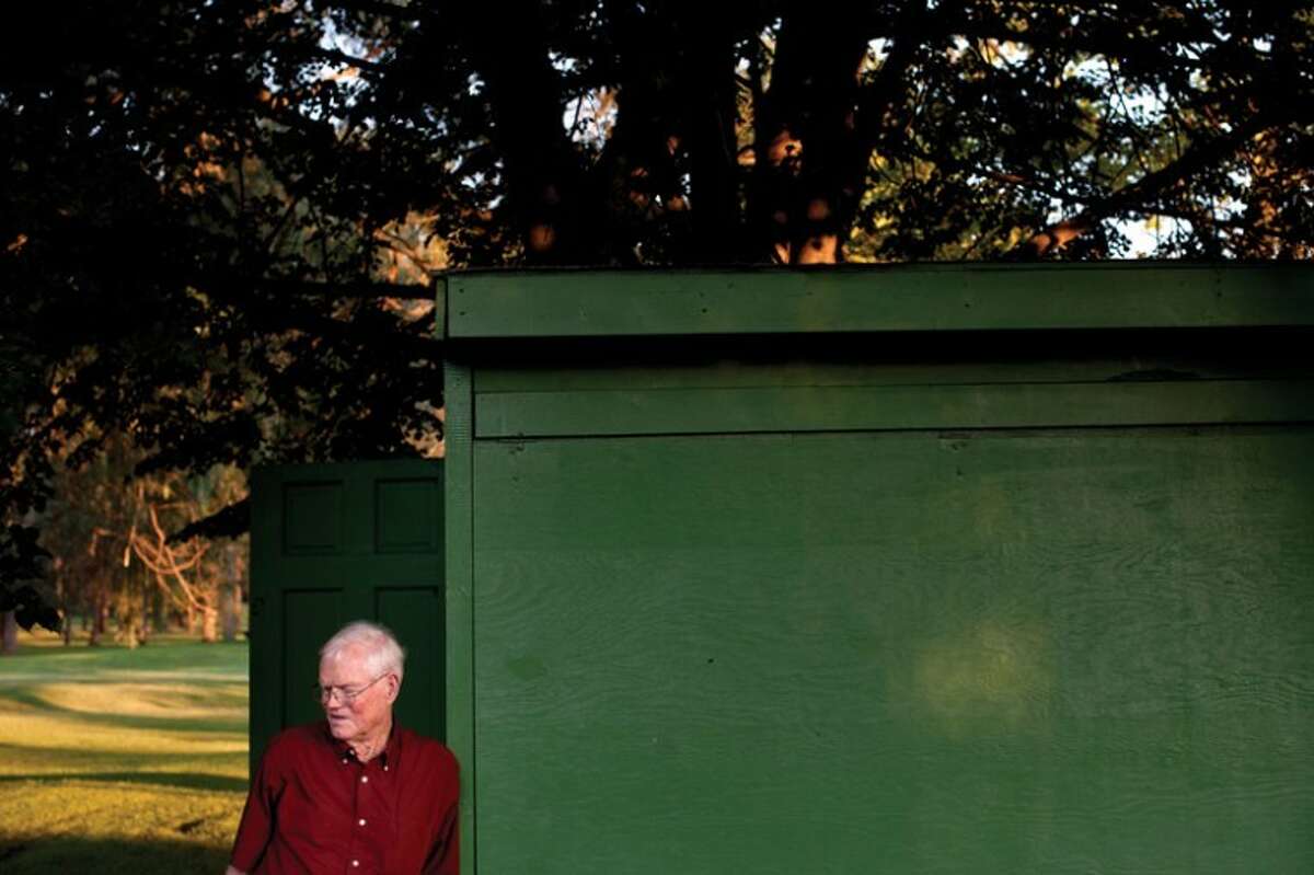 THOMAS SIMONETTI | tsimonetti@mdn.netIn this file photo, Doug Hand leans against a shed near the horseshoe pits at Emerson Park. The pits will be named after Hand, who recently died at the age of 76.