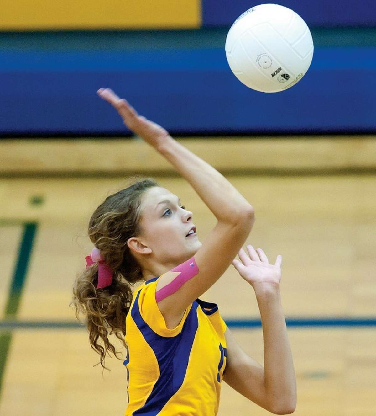 NICK KING | nking@mdn.netMidland's Tori Blake spikes the ball over the net during a recent Chemics volleyball match.
