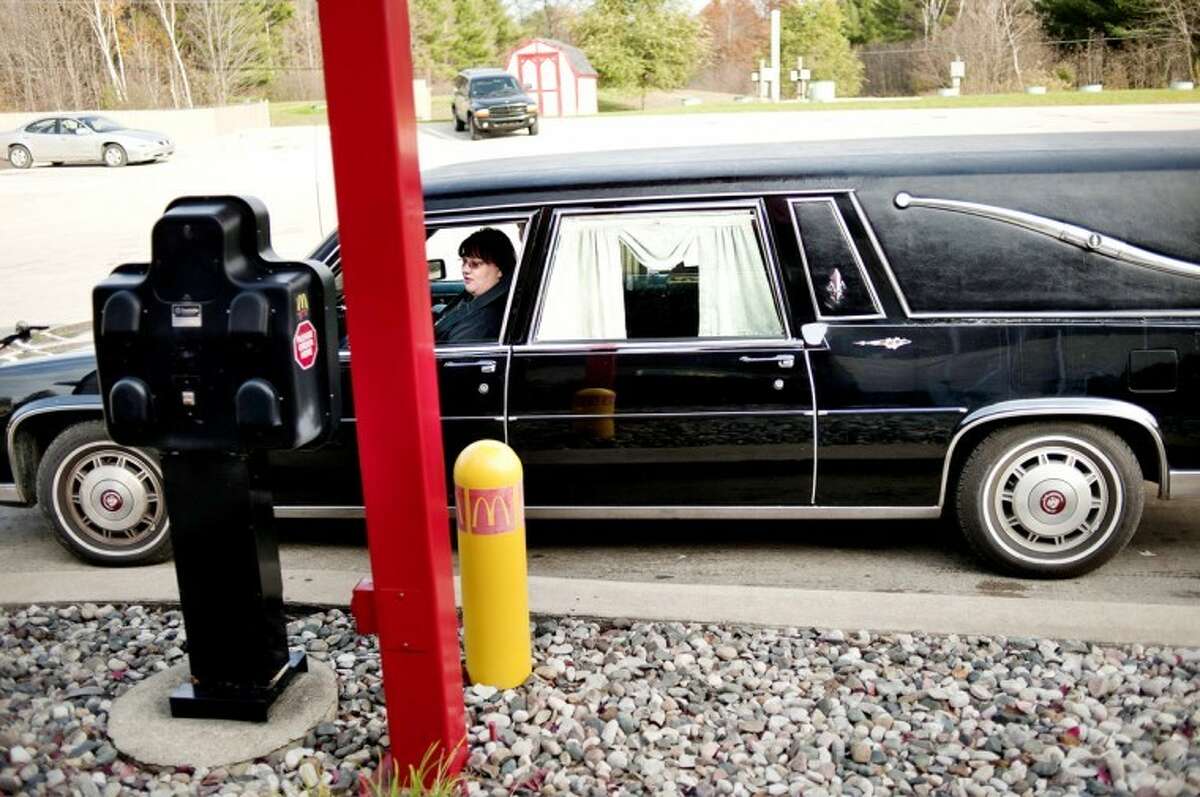 NICK KING | nking@mdn.netWhile in her hearse, Dawn Lueders orders from the Sanford McDonald’s drive-through on Friday. Lueders drives the spooky car around town during the fall months. Lueders bought the car from a horror author in Pennsylvania.