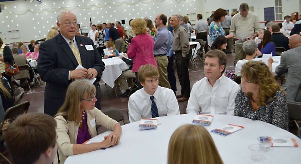 Photo providedScholarship donors Eileen Pearson and John Reder (former Midland County Sheriff) speak with recipients at the 2012 scholarship award banquet hosted by the Midland Area Community Foundation.