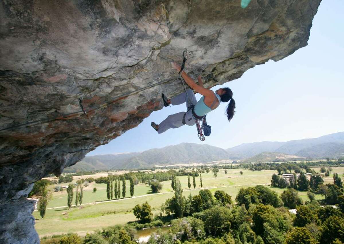 Greenwich artist Shelly Malkin climbing at Payne's Ford in New Zealand.