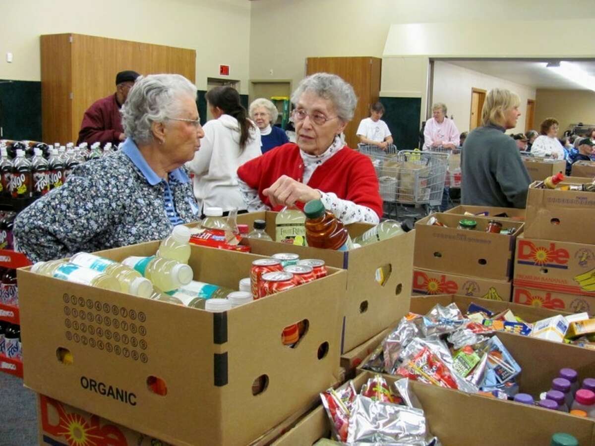 Volunteers prepare for a Midland County Emergency Food Pantry Network mobile food pantry in this Daily News file photo.