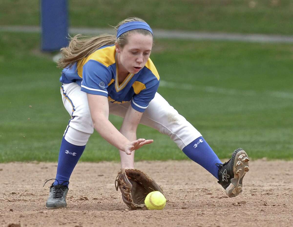 Newtown's Sara Kennedy (5), second base, fields a ground ball before throwing to first for the out during the girls high school softball game between Joel Barlow (Redding) and Newtown high schools, played at Newtown High School, on Wednesday, April22, 2015, in Newtown, Conn.