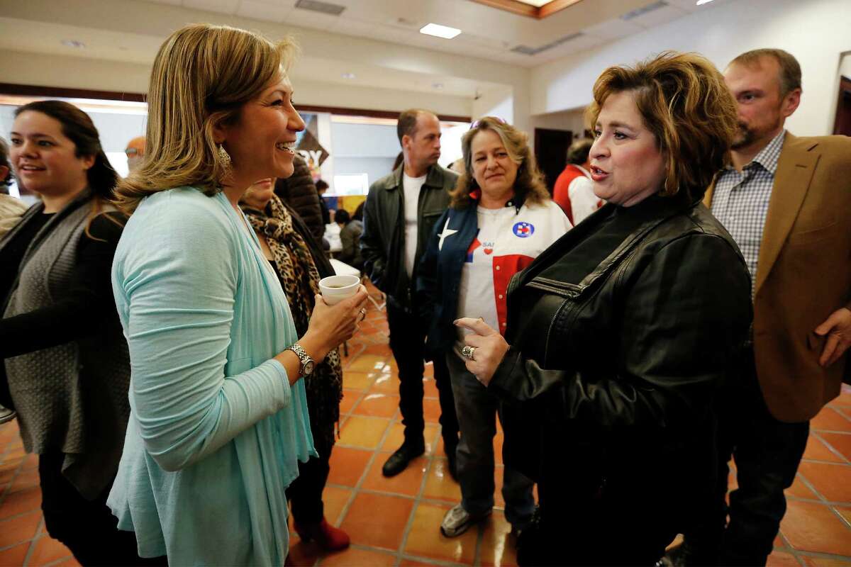 Hillary for America national political director Amanda Renteria (left) and Leticia Van de Putte (right) chat before rallying supporters for Democratic presidential candidate Hillary Clinton for the upcoming March 1 Primary on the Westside on Saturday, Feb. 6, 2016. Congressman Joaquin Castro also joined Van de Putte and Renteria to rally volunteers who signed up for block-walking and phone calls. (Kin Man Hui/San Antonio Express-News)