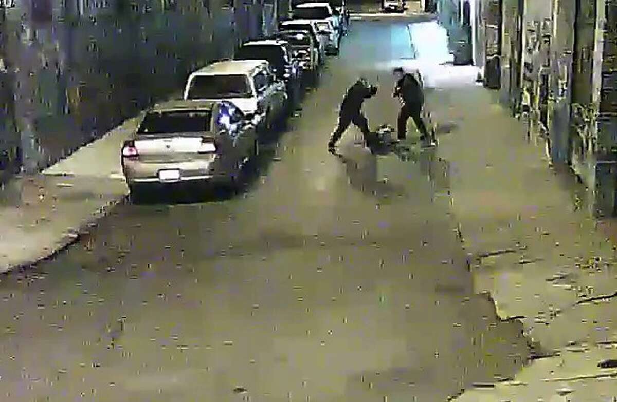 Two Alameda County sheriff’s deputies beat a man on a street in San Francisco’s Mission District in a video screen grab provided by the San Francisco Public Defender’s Office.