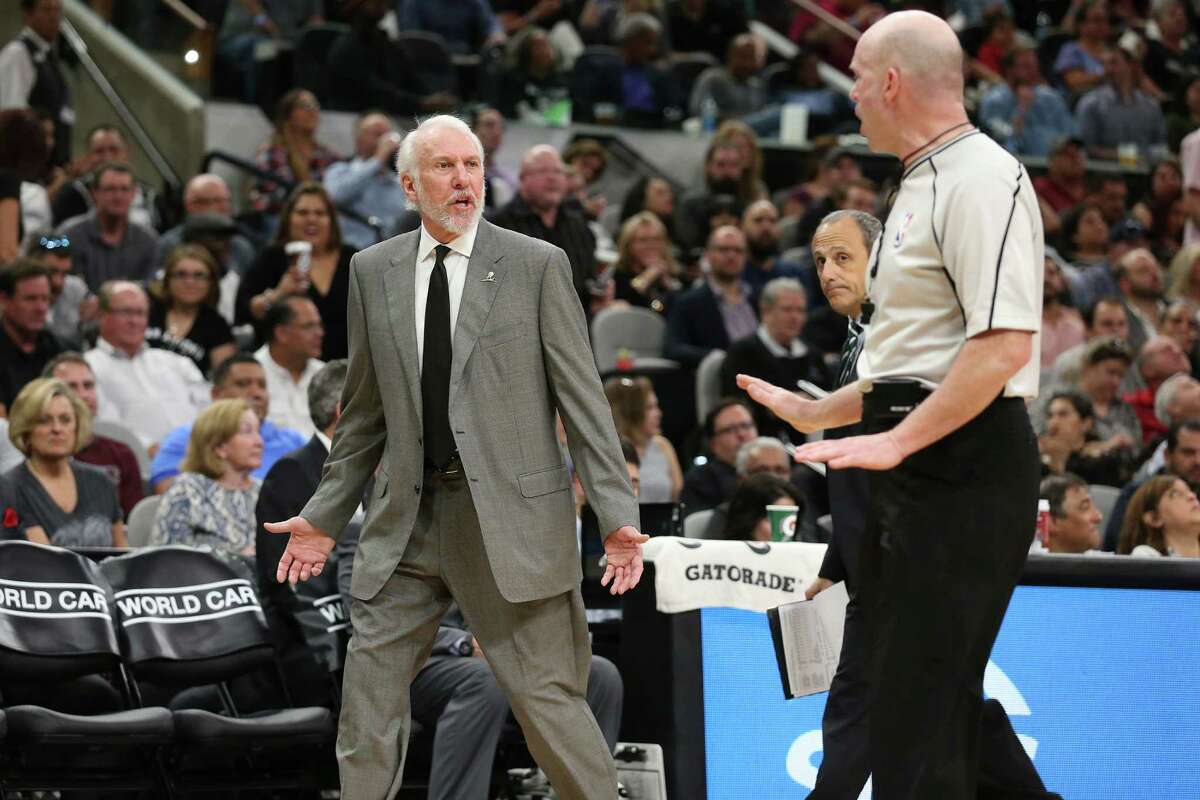 San Antonio Spurs' head coach Gregg Popovich challenges a call with official Gary Zielinski during the first half at the AT&T Center, Wednesday, March 23, 2016. Second before, Popovich was hit with a technical foul after arguing a possession call.