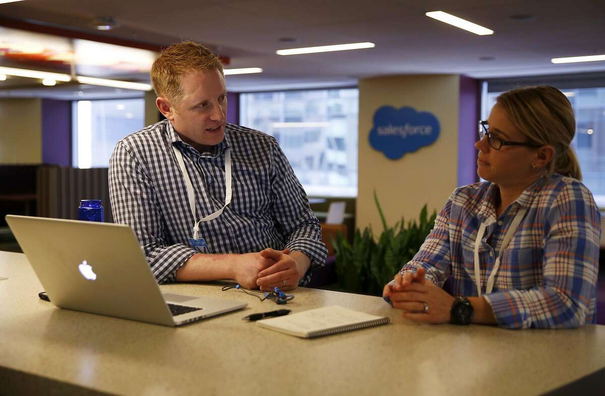 Sean Plankey (left), Coast Guard, and Cathy Borkoski, former Navy officer, discuss their project for the Breakline program hosted at Salesforce offices in San Francisco, California, on Thursday, March 24, 2016.