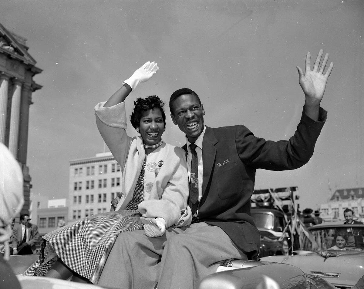 USF Dons are cheered at a parade in San Francisco March 25, 1955, after winning NCAA championship in basketball title Bill Russell and Rose Swisher