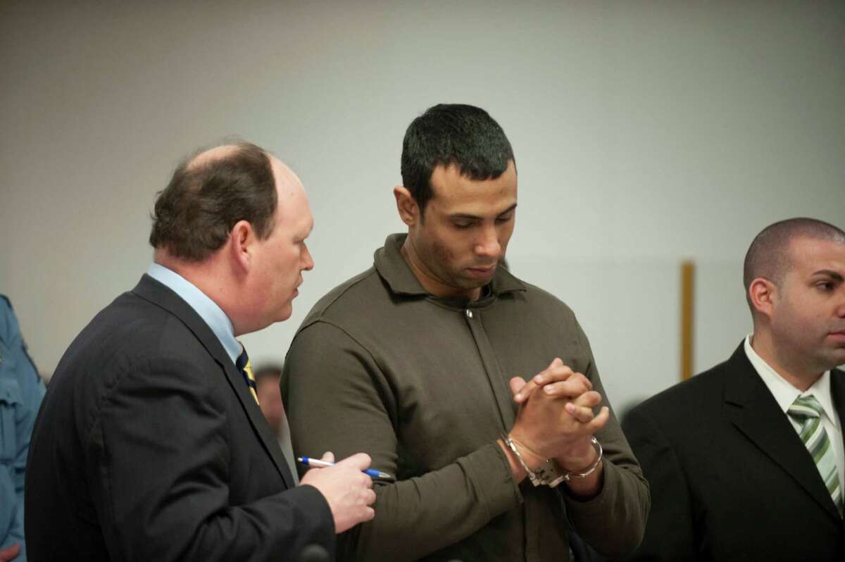 Defense attorney Daniel Ford talking to his client Alphah East, then a probation officer, during a bail hearing in Norwalk Connectiuct in January 2010 after he was charged with bribe taking.