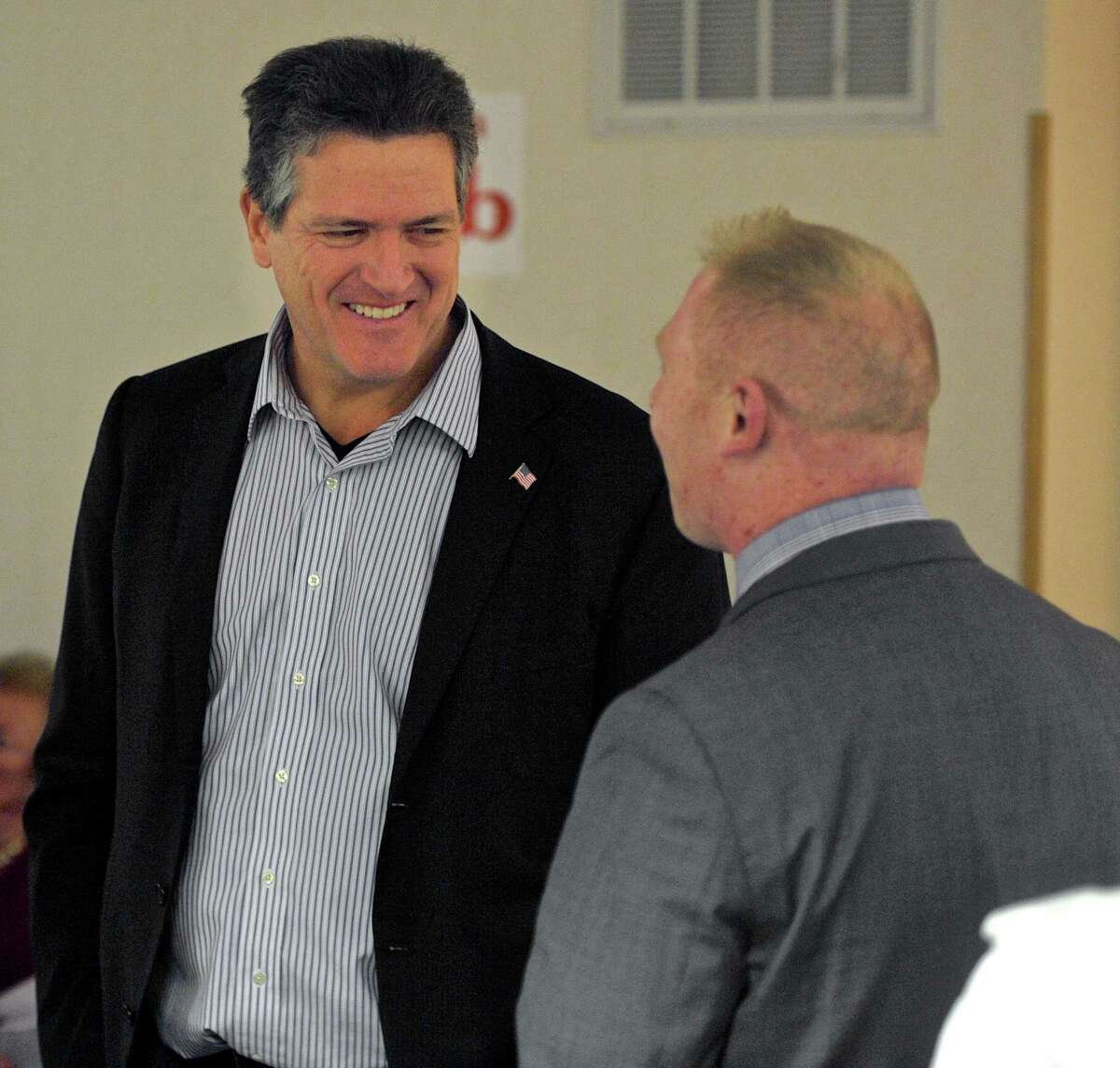 August Wolf, of Stamford, talks with State Rep. Stephen Harding, of Brookfield, at the Connecticut Republican Party Presidential Straw Poll earlier this year.