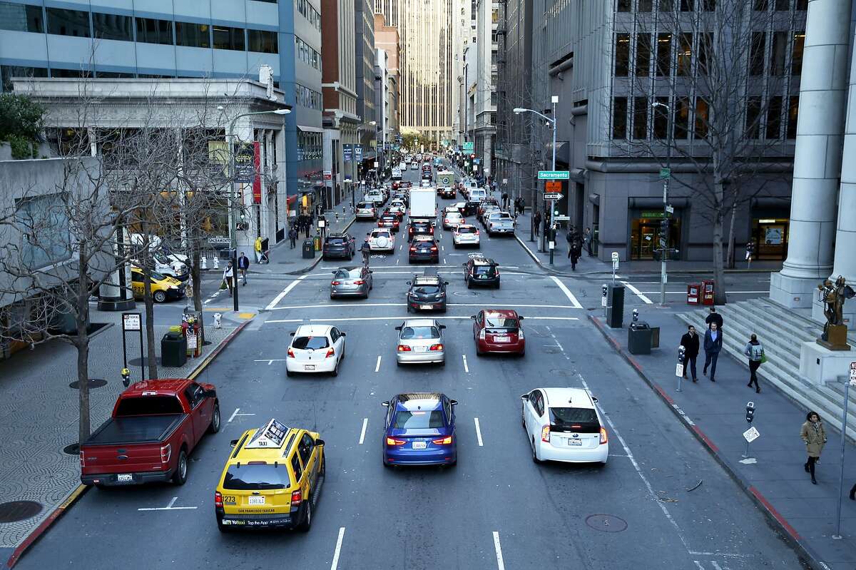 Traffic on Battery Street toward Market Street in downtown San Francisco, California, on Monday, Feb. 1, 2016.