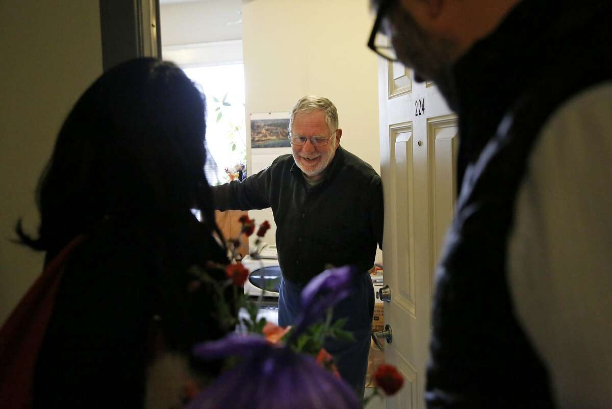 District 6 Supervisor Jane Kim, left, and Zendesk CEO Mikkel Svane, right, deliver a meal and flowers to resident Melvin Beetle for Meals on Wheels at the Raman Hotel March 23, 2016 in San Francisco, Calif. The delivery was part of Meals on Wheels' month-long campaign #MarchforMeals to raise awareness for the organization.
