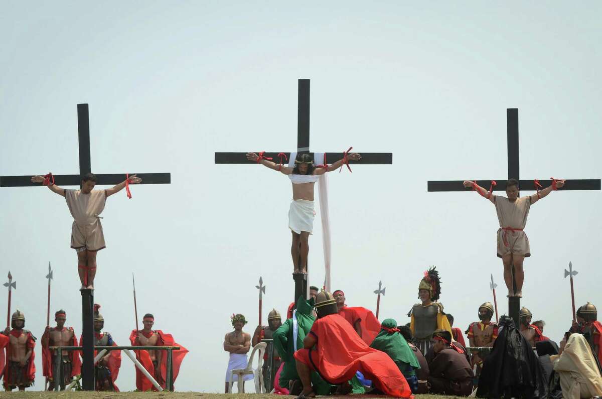 SAN FERNANDO, PAMPANGA - MARCH 25: Filipino penitents are nailed to the cross during a reenactment of Christ's crucifixion on March 25, 2016 in San Fernando town in Pampanga province, Philippines. The annual crucifixion rites draws huge crowds of people to normally sleepy towns in northern Philippines.
