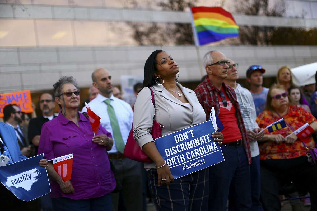 Demonstrators rally outside the Charlotte Mecklenburg Government Center in Charlotte, a day after North Carolina passed a law forbidding cities from enacting anti-discrimination protections for the LGBT community, March 24, 2016. The measure � hastily presented, passed and signed into law in just 12 hours � quickly prompted a wave of criticism from the business community as well. (Travis Dove/The New York Times)