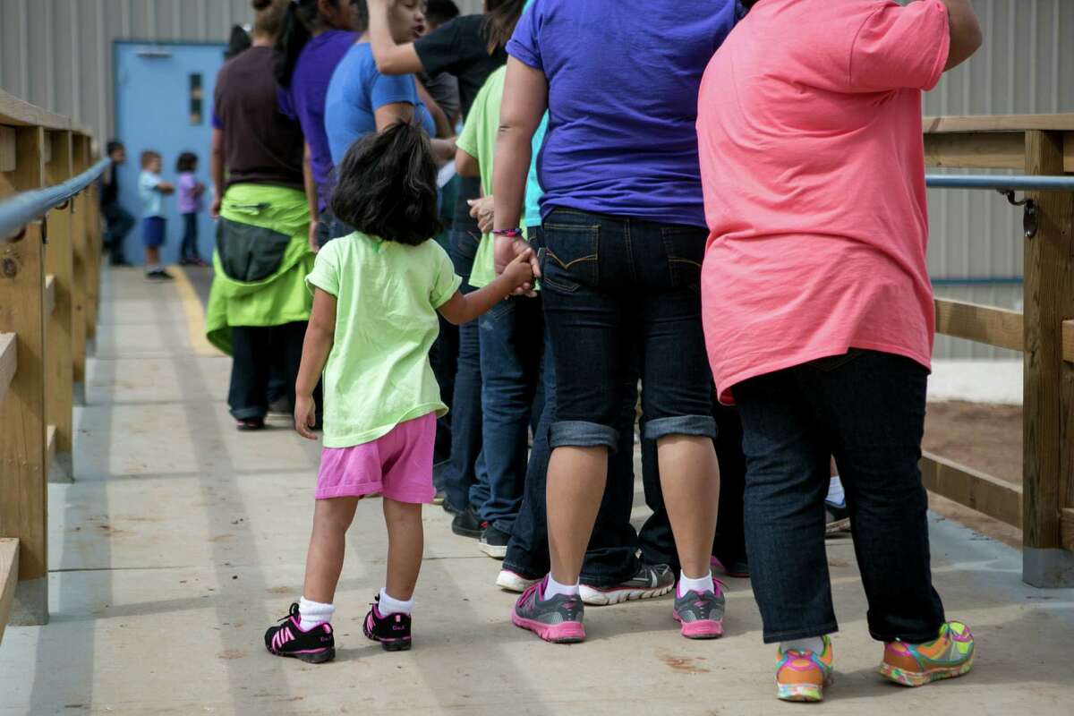In this file photo, residents line up to eat lunch at the South Texas Family Residential Center in Dilley that houses women and children. Immigrant advocates are quite correct. A prison — even a nicer one — is still a prison.