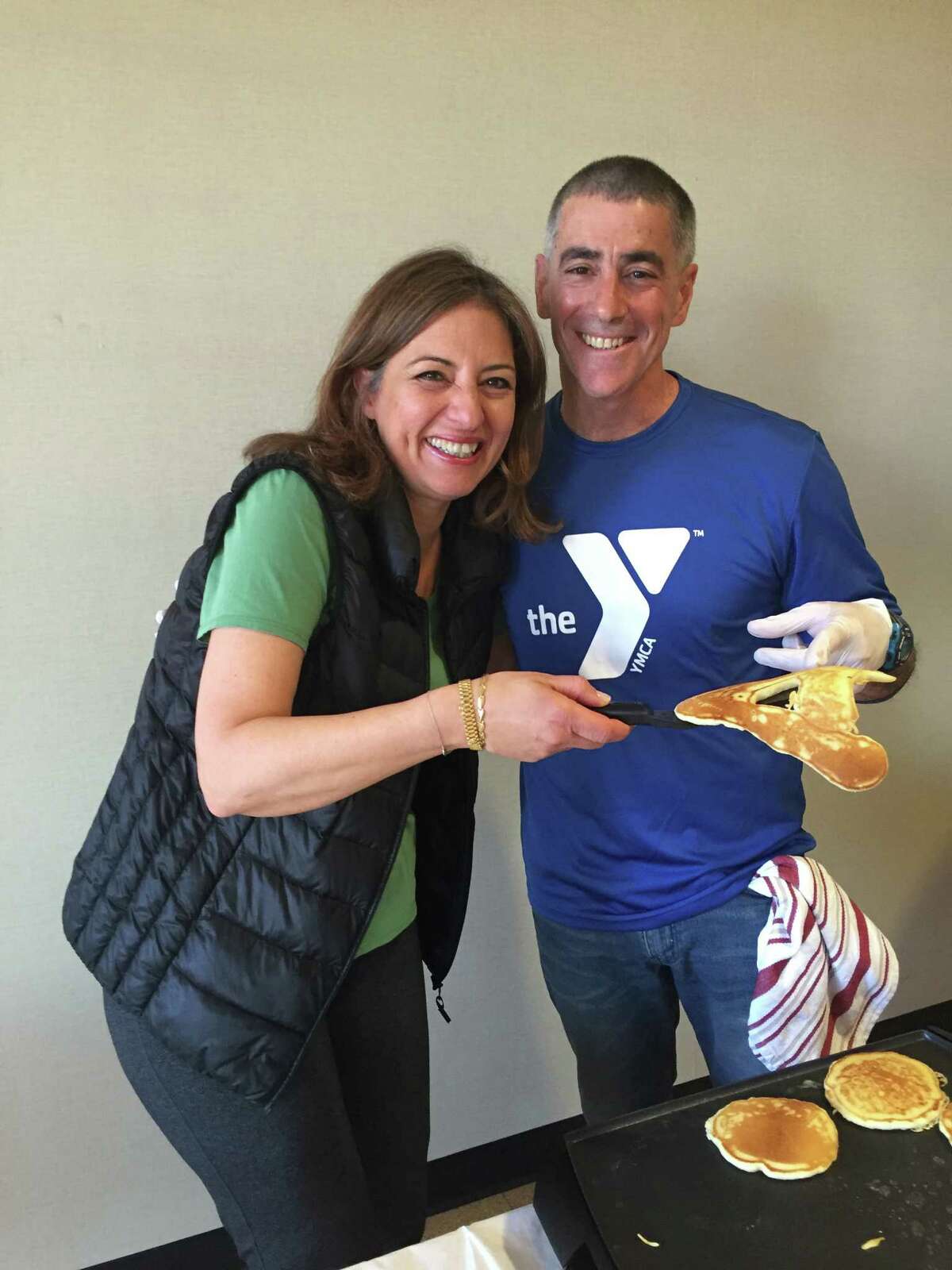 Greenwich YMCA member Aroub Bayazid, one of the winners of the first annual YMCA Chili contest and YMCA CEO and flapjack chef Bob DeAngelo at the pancake breakfast to honor the winners of the first annual YMCA Chili Contest.