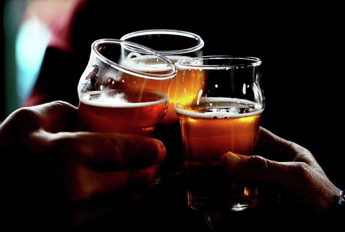 Scroll ahead to see some of the San Francisco, Oakland, and Alameda bars that may be pouring Pliny the Younger. Pictured: Russian River Brewing Company customers clink their glasses while drinking the newly released Pliny the Younger triple IPA beer on February 7, 2014 in Santa Rosa, California.