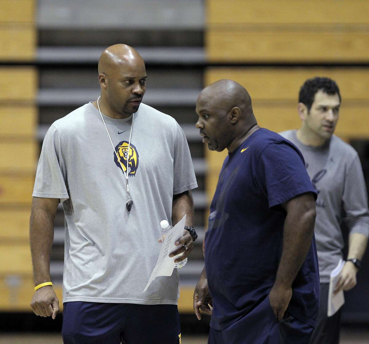 Basketball coach Cuonzo Martin chats with associate head coach Tracy Webster during the Cal men's basketball practice at Haas Pavilion in Berkeley, Calif., on Tuesday, November 11, 2014.