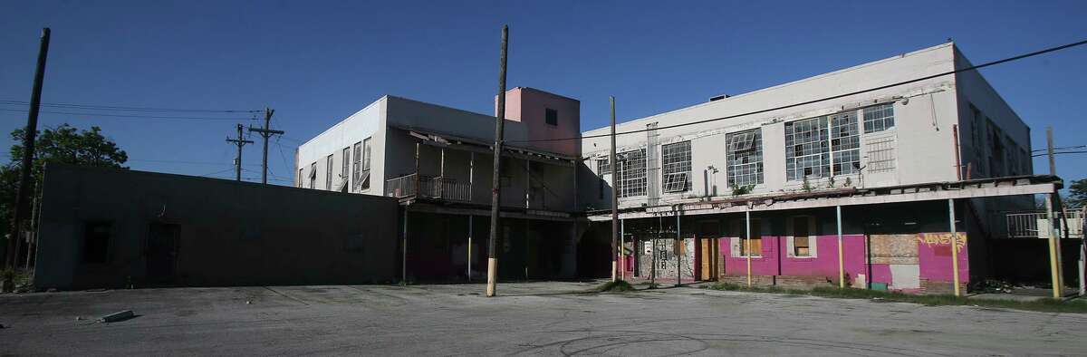 The Westside Development Corp. is seeking a partner to redevelop the Basila Frocks building.